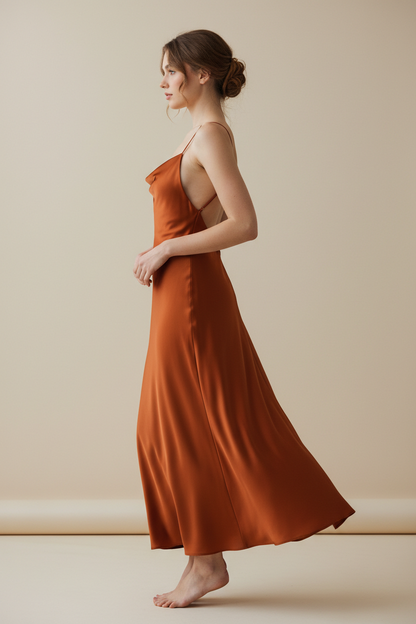 Rust orange satin slip dress - model side view